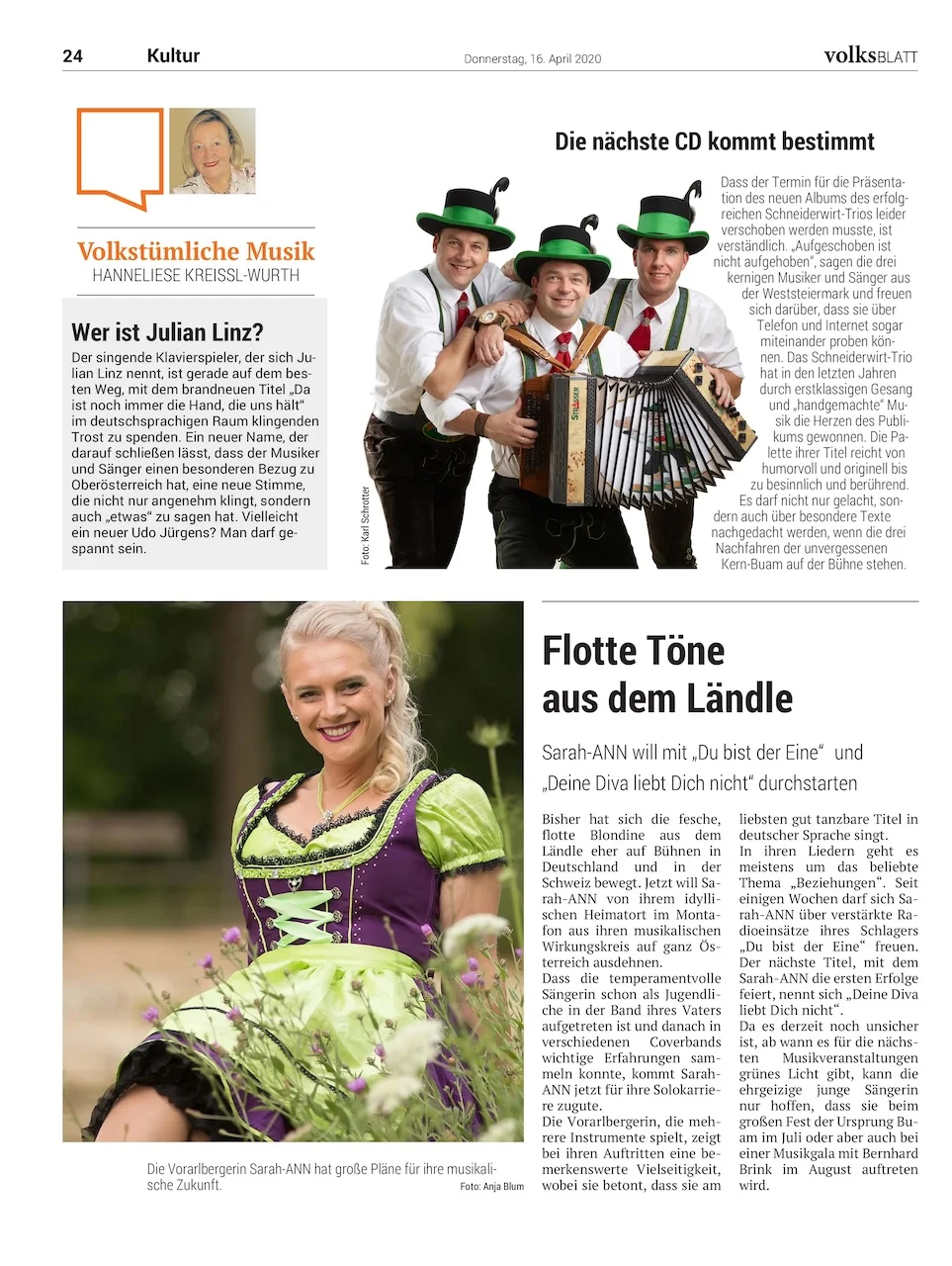 Zeitungsartikel im Volksblatt mit Foto von Sarah-ANN in einem grünen Dirndl auf einer Wiese. Der Artikel berichtet über ihre musikalische Karriere und Auftritte in Deutschland, Österreich und der Schweiz.